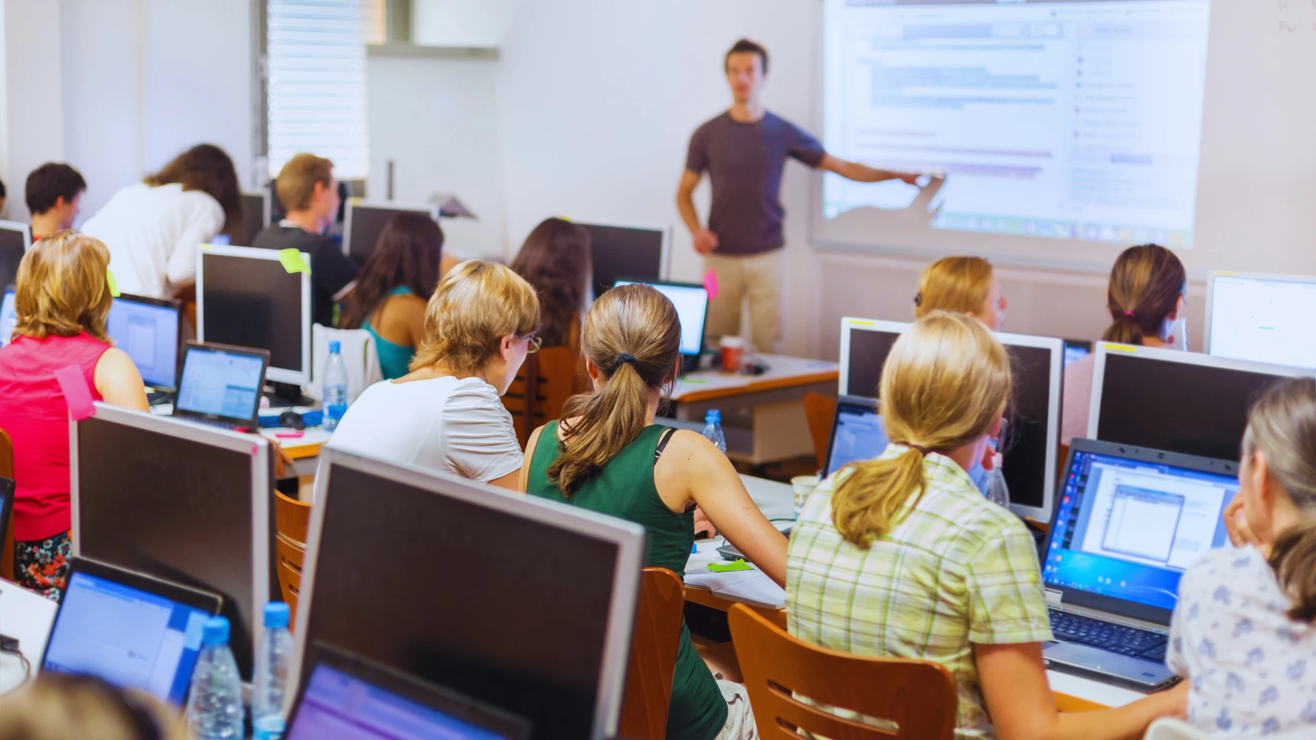 students-in-computer-classroom-learning-from-instructor