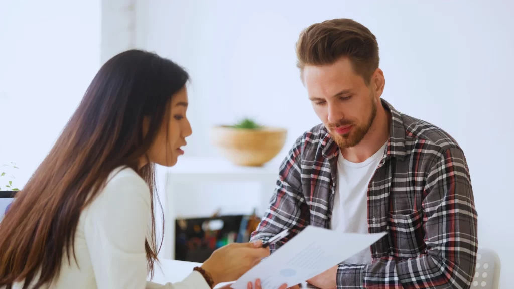 man-and-woman-reviewing-documents-in-professional-office-environment